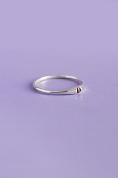 Elevate your everyday style with the delicately crafted Siyum silver ring. Handmade from genuine sterling silver, this minimal silver ring showcases a captivating red garnet. Embrace timeless elegance through this unique accessory perfect for your minimalist everyday style. Use the drop down menu to select your ring size and have the ring customised just for you DetailsSterling Silver jewelleryPersonalised jewellery handcrafted in our studioRound cut red garnet Minimal Silver Ring, Whole Lotta Love, Blue Green Sapphires, Green Sapphire, Red Garnet, Ring Handmade, Accessories Unique, Everyday Style, Everyday Look