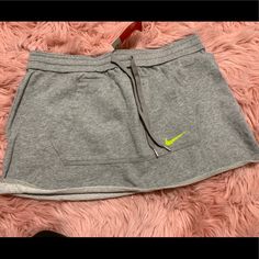 Dark Gray Nike Cotton Skirt. Green Nike Logo. Never Been Worn Still Has Tags. Nike Skirt, Nike Skirts, Gray Nike, Grey Nikes, Cotton Skirt, Nike Logo, Dark Gray, Nike Women, Womens Skirt