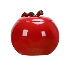 a large red ceramic pot with a lid