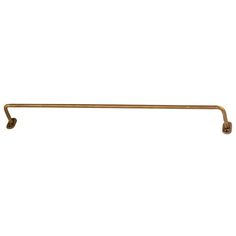 an antique brass towel bar on a white background