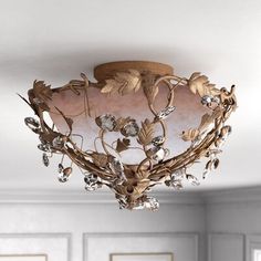 a chandelier hanging from the ceiling in a room