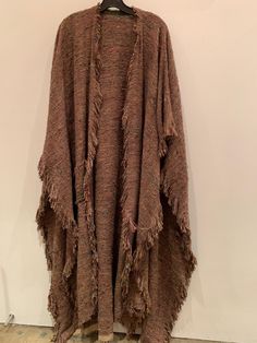 Brown Fringe One Size Poncho, One Size Brown Fringe Poncho, One Size Bohemian Beige Wrap, Bohemian One Size Beige Wrap, One Size Beige Bohemian Wrap, Brown One Size Poncho With Fringe, Brown Shawl Wrap For Fall, Fall Brown Shawl Wrap, Bohemian Beige Handwoven Shawl