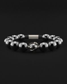 Embrace the power of self-liberation with the Waves Bracelet. This 12mm design, featuring a unique wave pattern encircling a captive ball, symbolizes the mental boundaries we often impose on ourselves. It serves as a constant reminder that the limits we face are often of our own making, and it is within our power to transcend them. Each glance at your wrist with this bracelet will inspire you to unlock your true potential and break free from self-imposed constraints. All our stones are chosen by hand to satisfy AAA quality standards. They are natural stones and their size and color can vary slightly. Stone: AAA Grade 12mm Metal: 18K Solid Gold (Rose) 100% Handcrafted Package: Luxury Box Waves Bracelet, Black Diamond Bracelet, Graduation Jewelry, Wave Bracelet, Bracelet In Silver, Stacked Necklaces, Gold Armband, Red Tigers Eye, White Gold Bracelet