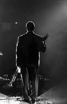 a man standing in the middle of a stage