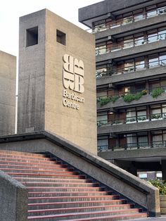 a building with stairs leading up to it and the words bauhden centre on top