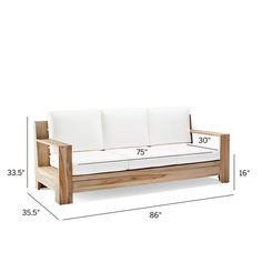 a wooden couch sitting on top of a white floor