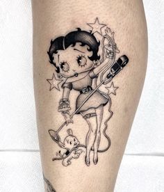 a woman with a tattoo on her leg holding a hair dryer and a teddy bear