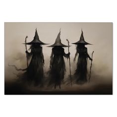 three witches in black and white with their hands on their hipss, walking through the fog