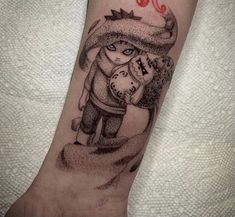 a tattoo on the arm of a person with a red and black ink drawing of a girl holding an umbrella