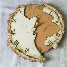 a clock that has been made to look like a piece of pie with roman numerals