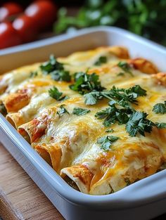 a casserole dish with cheese and vegetables in it sitting on a cutting board