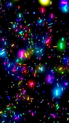 colorful confetti sprinkles on black background