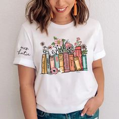 Flower Books Shirt, Gift For Book Lover, Gift For Bookworms, Teacher Gift TH T-Shirt Made from airy fabric, can be worn all year around, good sweat absorbing, wear at home, good sleepwear, or any sports activities. Great as Birthday gifts, any Holiday presents for loved ones or It's a gift to yourself. This adorable item can be designed upon anyone's wish with any title. Product details: Brand: Gildan Classic unisex cut makes this easy to fit the body. Material: Cotton Heavyweight Fabric. Sport Merch Shirt, Fun Music, Fan Fashion, Book Tshirts, Tour Merch, Taylor Swift Album, Gifts For Bookworms, Book Shirts, Personalized Clothes