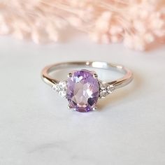 Timeless and elegant, our best-selling lavender amethyst ring features the beautiful pastel coloured ameythyst. As seen in VOGUE Magazine 'Jewellery Designer Profile' - September 2021 issueThis gorgeous ring is made with natural lavender amethyst - a unique pale purple stone. It is handcrafted in solid sterling silver and plated with rhodium for a lustrous finish and durability.Amethyst is believed to have numerous healing properties such as relieving stress and strain, soothing irritability, ba Affordable Purple Promise Ring, Purple And White Rings, Labender Wedding Ring, Luxury Lavender Ring For Gift, Luxury Lavender Ring Gift, Luxury Lavender Rings For Gift, Purple Engagement Rings, Lavender Amethyst