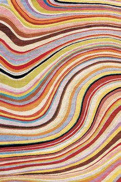 a multicolored rug with wavy lines on it