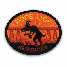 a black and orange patch with the words pope lick kentucky on it