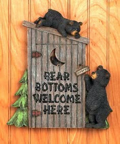 two bears are sitting in a birdhouse with the words bear bottoms welcome here on it