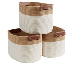 three woven storage baskets with leather handles