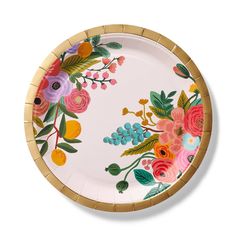 a white plate with colorful flowers painted on the side and gold trimming around it