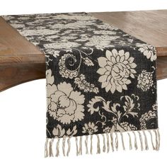 a black and white table runner with flowers on it