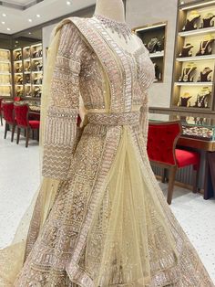 Look your best on your wedding day in this beautiful champagne bridal lehenga. The BL-158 is designed to help you shine with its gorgeous color and intricate details. A perfect combination of elegance and comfort. Fabric: Net with satin lining WASH CARE INSTRUCTIONS - Please Dry clean only when it is applicable. Ready to Ship! Champagne Lengha Bridal, Wedding Gown With Dabka Work And Traditional Drape, Elegant Wedding Gown With Dabka Work, Bollywood Style Wedding Gown With Resham Embroidery, Bollywood Anarkali Set For Wedding With Traditional Drape, Semi-stitched Kundan Gown For Wedding, Festive Wedding Gown With Cutdana Details, Bollywood Style Anarkali Set For Wedding, Long Fitted Lehenga With Intricate Embroidery