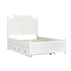 a white bed with drawers underneath it and a headboard on the bottom half of the bed