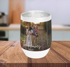 a personalized coffee cup with a family photo on it