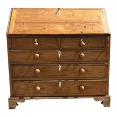 an old wooden dresser with drawers and knobs