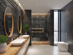 a modern bathroom with two sinks and large mirrors on the wall next to each other