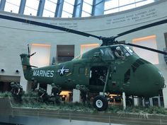 an army helicopter on display in a museum