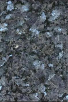 a granite counter top with blue and black colors