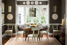 a dining room table with four chairs around it