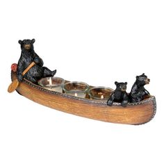 two bears on a boat with candles in it