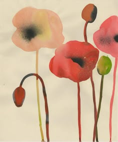 an image of three flowers that are in the air with watercolors on paper