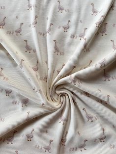 an image of a white fabric with llamas on it