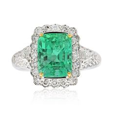 Art Deco-inspired Colombian origin Emerald ring of 3.58 carats. Brilliant and vibrant, this Emerald is a one of one. The Emerald center stone is complemented by 62 round, brilliant-cut side stones and mounted by an 18 karat white gold setting. ✔ Gold Karat: 18K ✔ Emerald Weight: 3.58 carats ✔ Emerald Origin: Colombia ✔ Emerald Cut: Emerald ✔ Diamond Weight: 62 Diamonds, 0.71 carats total ✔ Diamond Color: G-H ✔ Diamond Clarity: SI1 ✔ Certificate of appraisal included upon request SHIPPING TIMES U Luxury Radiant Cut Emerald Ring With Halo Setting, Luxury Green Diamond Ring For Anniversary, Luxury Green Brilliant Cut Halo Ring, Luxury Green Halo Ring With Brilliant Cut, Luxury Emerald Ring With Center Stone, Luxury Platinum Emerald Ring With Halo Setting, Luxury Platinum Emerald Ring With Diamond Cut, Luxury Gia Certified Emerald Ring For May Birthstone, Luxury Green Diamond Halo Ring