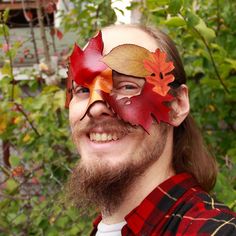 A chill wind stirs the forest, stripping the year's growth from the trees and casting the changing colors of the foliage to the ground. This asymmetric mask showcases the beauty of the season, and every copy's coloration will be somewhat different. A perfect design for the harvest festival, or for holding back the arrival of the Winter Court. The dyes for this design are hand-mixed and hand-applied to best emulate the colors of real leaves, so there will be some color variation between each mask.  Made of 4 oz vegetable tanned leather, it comes with a leather cord to knot in the back. The mask is cut with a laser cutter, providing highly accurate cut patterns. It is hand-dyed, then wet-formed into shape and sealed with a clear acrylic coat. The leather is fairly stiff, but is still somewha Winter Court, Costume Masks, Real Leaves, Fallen Leaves, Harvest Festival, The Harvest, Star Pictures, Hair Piece, Vegetable Tanned Leather