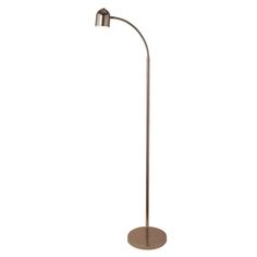 a metal floor lamp with a round base