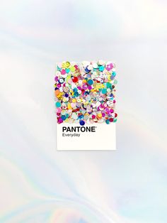 the pantone company brochure is covered in multicolored jewels