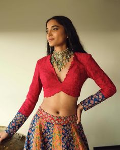 Step into the spotlight with this striking multicolor lehenga, featuring a blend of rich patterns and textures. Paired with a deep red blouse and statement jewelry, this ensemble beautifully merges tradition with contemporary style. Perfect for weddings, festive occasions, or cultural events, this look is for those who love to make a bold, fearless fashion statement. Multicolor Lehenga, Bald Hair, Red Blouse, Cultural Events, Multicolor Dress, Red Blouses