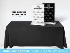 a table top banner is displayed on a black table