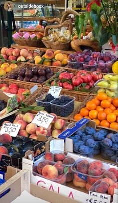 an assortment of fresh fruits and vegetables for sale