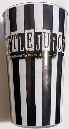 a black and white striped bucket with the words beetlejuice on it