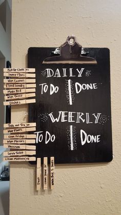 a bulletin board with clothes pins attached to it and the words daily to do, weekly to do