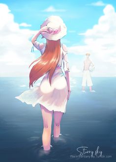 a woman with long red hair standing in the ocean next to a man wearing a white hat