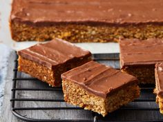 several pieces of cake sitting on a cooling rack