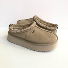 Product Specs: * Suede Upper. * Tasman Braid. * 10mm Uggplush 80% Upcycled Wool, 20% Lyocell Lining. * 10mm Uggplush 80% Upcycled Wool, 20% Lyocell Insole. * Treadlite By Ugg Outsole. * Textile Binding. * Eva Outsole. * 1.5" Platform Height. * Genuine Fleece Sock Liner For Comfort And Warmth. * Top-Of-The-Line Australian Winter Boots. * All My Ugg Are 100% Authentic, Brand New And Never Been Worn. ** The Inside Sizing Tag Is Marked To Avoid Store Returns. This However Did Not Effect The Look. Wh Ugg Season, Fuzzy Sandals, Fluffy Sandals, Australian Winter, Ugg Tazz, Ugg Slides, Ugg Sandals, Currency Converter, Ugg Women