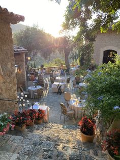 an outdoor dining area with tables and chairs