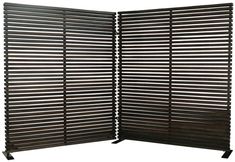 a room divider made out of wooden slats