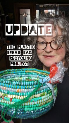 a woman holding up a plastic bag filled with beads